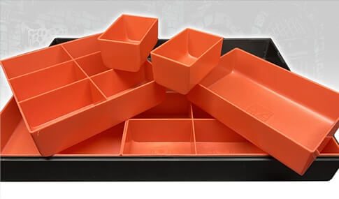 Orange and Black Organizer with Orange pieces pulled out showing modularity without lid